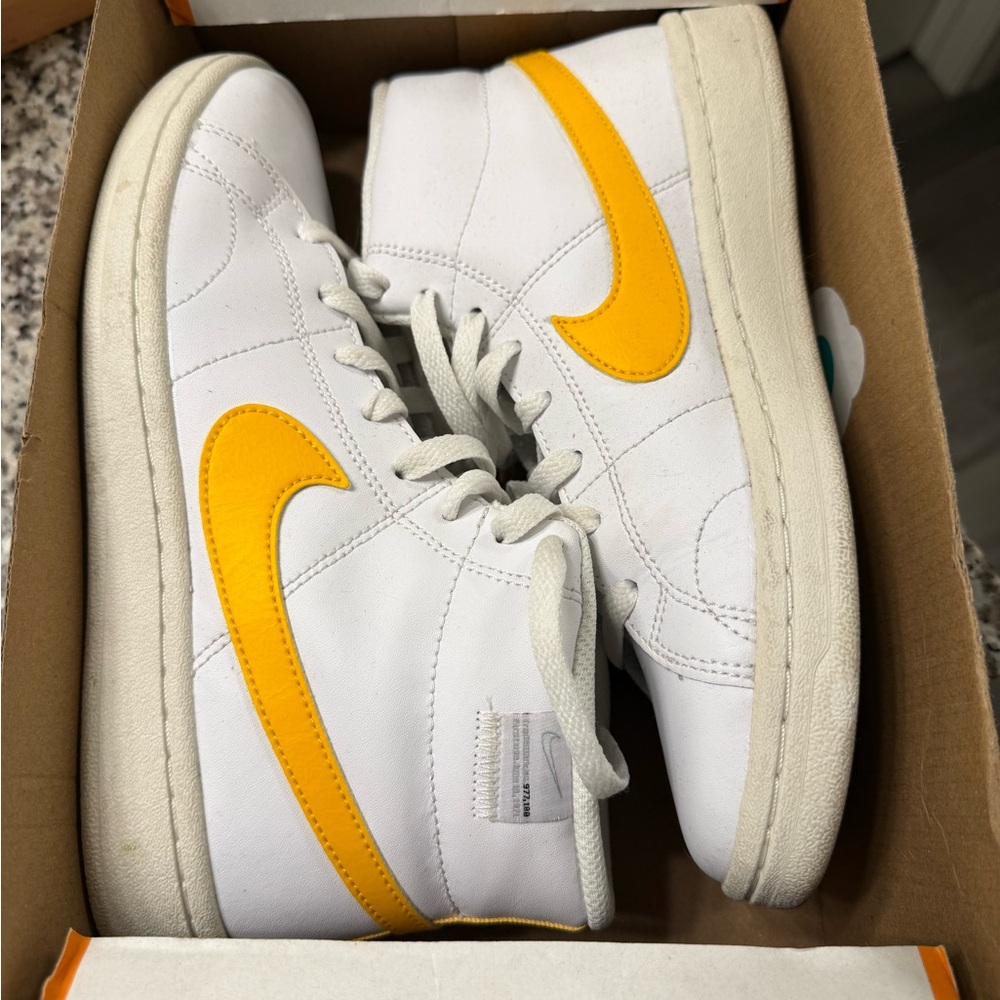 Nike White High-Top Sneakers with Yellow Swoosh